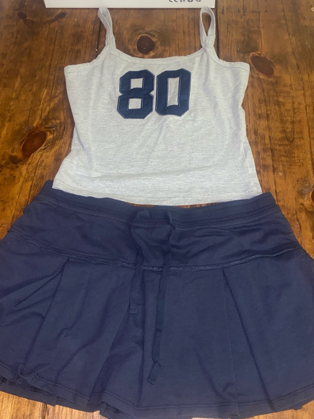 Edikted Navy and gray tank top
Blue Pleated pacsun Mini Skirt Set